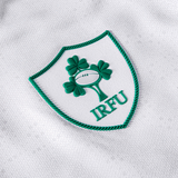 The Women's Ireland 25/26 Alternate Pro Jersey by Canterbury features the IRFU logo with three green shamrocks and a rugby ball in a green-bordered shield—a classic white Ireland rugby jersey.