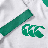 Close-up of the Women's Ireland 25/26 Alternate Pro Jersey by Canterbury: a white pro jersey with green trim and Canterbury's logo featuring three stylized "C" shapes, printed on the fabric.