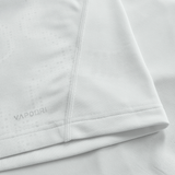 Close-up of a white athletic shirt with visible stitching and "VAPODRI" near the hem, highlighting the quality of the Ireland 25/26 Alternate Pro Jersey by Canterbury.