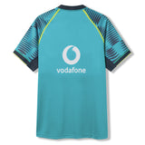 Back view of the Ireland 26 Pre Game Pro Jersey by Canterbury in teal, showcasing a central Vodafone logo and dark blue, striped raglan sleeves with neon yellow accents. This Canterbury sports jersey is crafted with moisture-wicking technology to keep you comfortable during intense training sessions.
