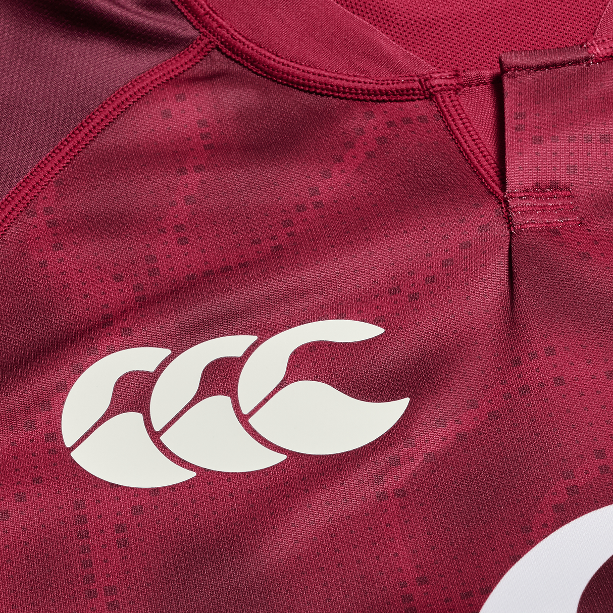 Close-up of the Ireland 25/26 Autumn Internationals Pro Training Jersey by Canterbury, featuring a maroon design with the iconic white Canterbury logo on the chest—ideal for showing your support this season.