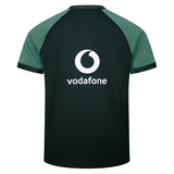 Back view of the Ireland 25/26 Six Nations Pro Training Jersey by Canterbury in black and green, featuring a white Vodafone logo and text on the upper back. Designed for top performance and comfort.