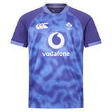 The Ireland 25/26 Six Nations Pro Training Jersey by Canterbury is a blue and purple short-sleeve top with Vodafone, IRFU, and Canterbury logos on the front.