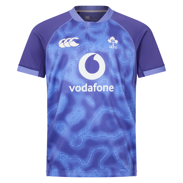 The Ireland 25/26 Six Nations Pro Training Jersey by Canterbury is a blue and purple short-sleeve top with Vodafone, IRFU, and Canterbury logos on the front.
