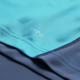 Close-up of blue athletic fabric from the Ireland 26/27 Summer Tour Training Pro Jersey by Canterbury, featuring "VAPODRI" print, detailed stitching, and textured Pro Fit style.
