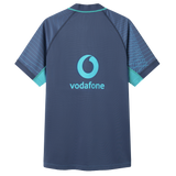 The Ireland 26/27 Summer Tour Training Pro Jersey by Canterbury is a navy blue, short-sleeved jersey with turquoise accents, a Pro Fit design, and a Vodafone logo centered on the back.