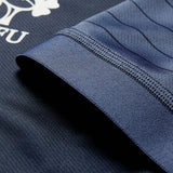 Close-up of a navy blue Ireland 26 Training Pro Jersey by Canterbury sleeve, showing visible stitching and part of the white Canterbury logo and text on the fabric, featuring VapoDri technology.
