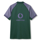 The Ireland 26 Training Pro Jersey by Canterbury is a green short-sleeve sports jersey with purple shoulder panels, featuring VapoDri technology for enhanced comfort and moisture management, and a large Vodafone logo on the back. Perfect for training sessions, this official Canterbury jersey combines performance and style for Ireland Rugby fans.
