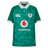 The Youth Ireland 25/26 Home Pro Jersey by Canterbury is a green, short-sleeve rugby top with a white collar and cuffs, featuring Canterbury, Vodafone, and IRFU logos on the front.