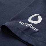 Close-up of the Ireland 26/27 Summer Tour Team Cotton T-Shirt by Canterbury in navy blue, with the Vodafone logo and name embroidered in white on the sleeve—ideal for supporting Ireland this summer.
