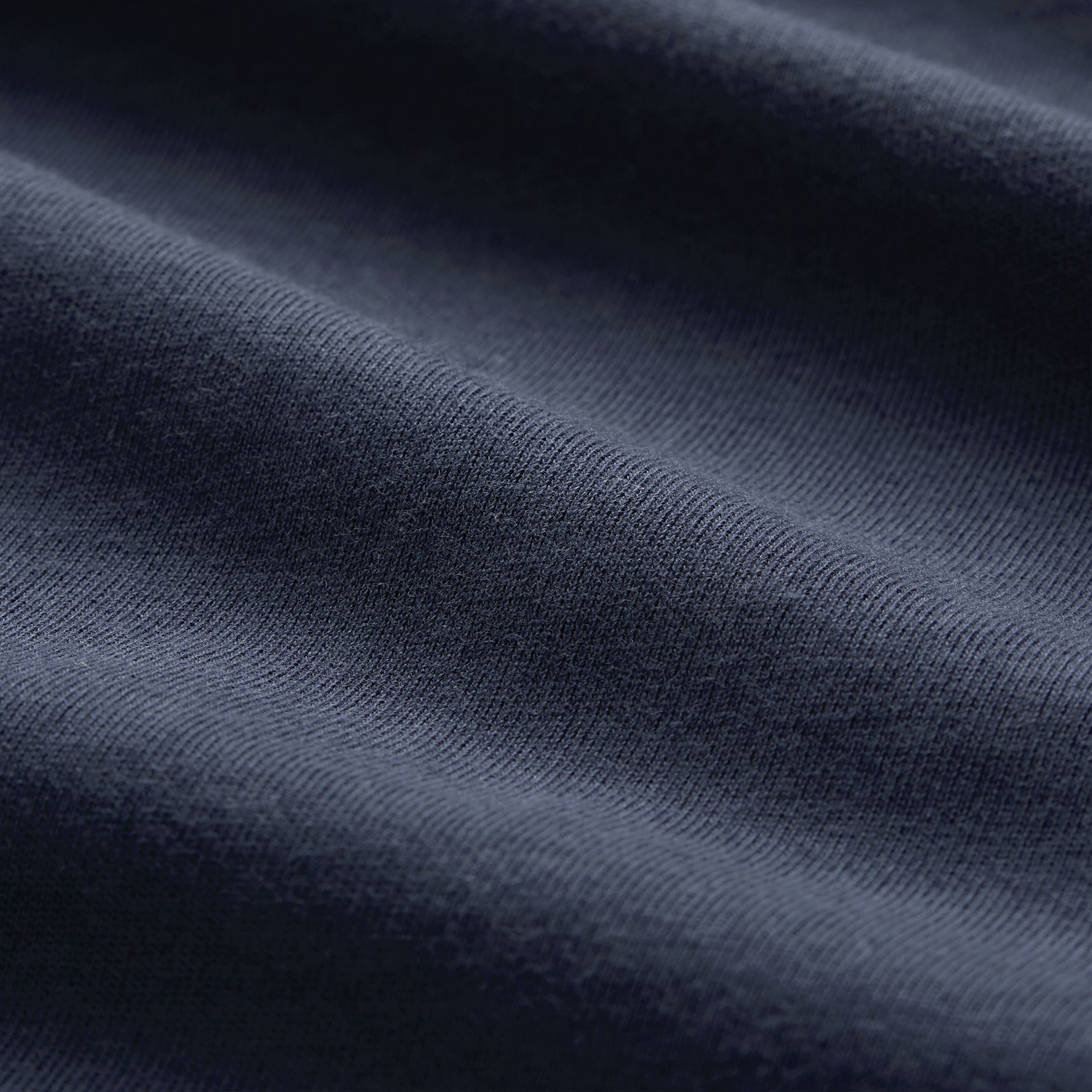 Close-up of dark blue Canterbury fabric with visible texture and soft folds—ideal for the Ireland 26/27 Summer Tour Team Cotton T-Shirt by Canterbury.