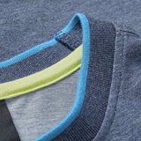 Close-up of the Ireland 26/27 Summer Tour Team Cotton T-Shirt by Canterbury, featuring a blue collar with ribbed navy trim and light blue and green accents inside—an ideal choice for your summer tour.