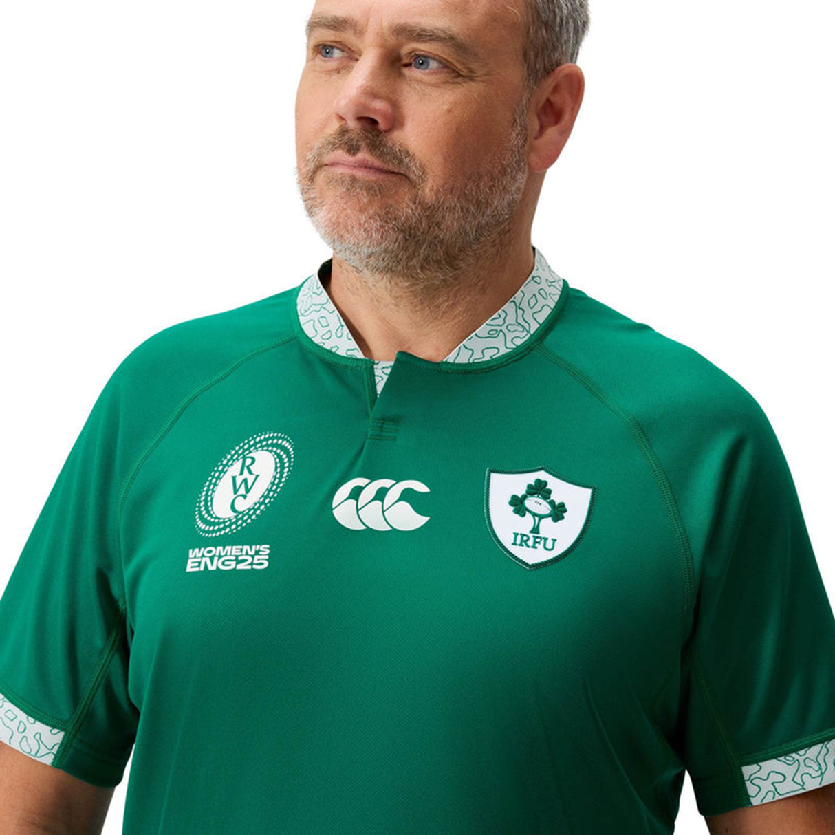 A man stands against a plain white background wearing the Canterbury Ireland WRWC25 Replica Home Jersey, featuring sponsor logos.