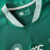 Close-up of the Women's Ireland WRWC25 Replica Home Jersey by Canterbury, size 10, in green with a patterned white collar and visible brand and size labels.