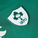 Close-up of the Canterbury Women's Ireland WRWC25 Replica Home Jersey crest on green fabric—official merchandise for fans.