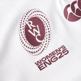 Close-up of a white Canterbury Women's Ireland WRWC25 Replica Alternate Jersey showing the RWC logo and "Women's IRE25" in maroon lettering.