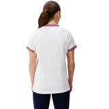 A person with brown hair in a ponytail is shown from the back wearing the Canterbury Women's Ireland WRWC25 Replica Alternate Jersey and dark pants.