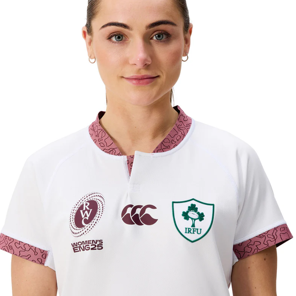 Someone wearing the Women's Ireland WRWC25 Replica Alternate Jersey by Canterbury, featuring the IRFU emblem, 2025 WRWC alternate branding, and Canterbury's logo on the front.