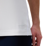 A close-up of a person’s hand resting by their side, wearing the Canterbury Women's Ireland WRWC25 Replica Alternate Jersey and dark pants.