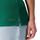 A woman wearing the Women's Ireland WRWC25 Classic Jersey by Canterbury, featuring "VAPODRI" branding, and light blue jeans is shown from the side with her hand by her hip.