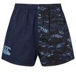 The Canterbury Force Harlequin Drill Shorts for men feature one solid navy blue leg, one with a blue and black abstract pattern, and a logo on the solid side.