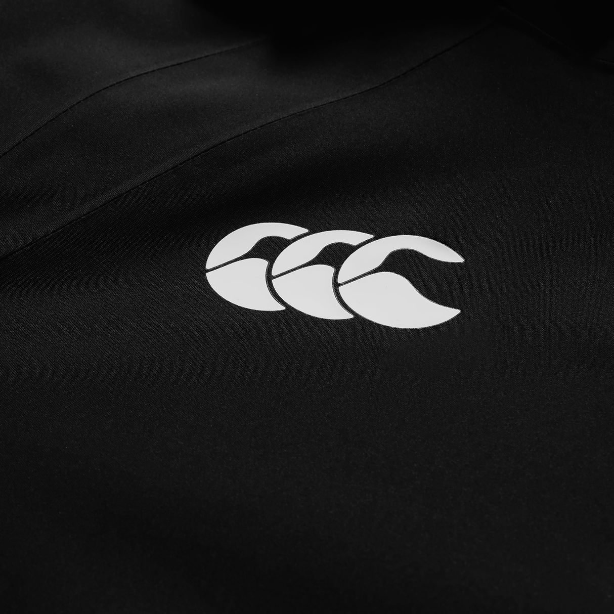 The black Ireland 25/26 Water Resistant Insulated Jacket by Canterbury features a white triple wave logo.