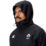 Man in an Ireland 25/26 Water Resistant Insulated Jacket by Canterbury, looking to the side against a plain background.