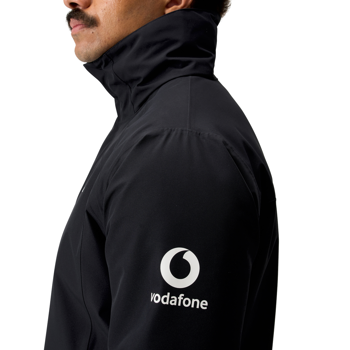 A person wearing the Canterbury Ireland 25/26 Water Resistant Insulated Jacket with a white Vodafone logo on the sleeve, shown from the side against a white background.