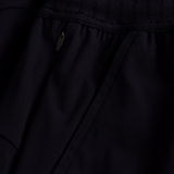 Close-up of the black Ireland 25/26 Gym Training Short by Canterbury, showcasing a zippered pocket with metallic pull and detailed stitched seams.