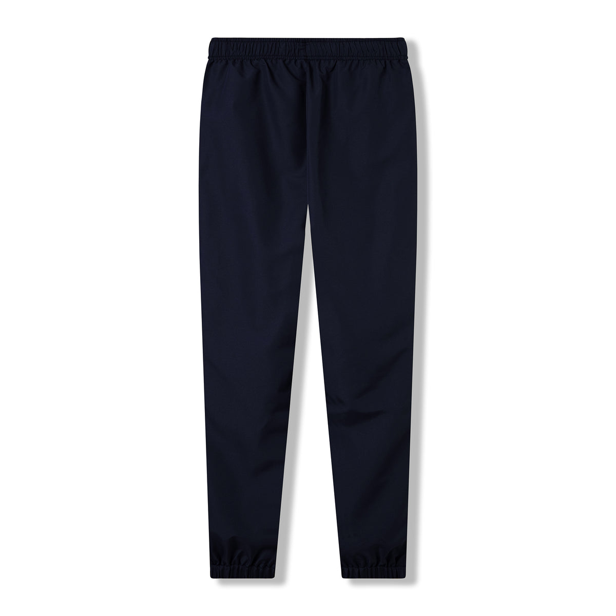 The Ireland 26 Legends 32″ Trackpant by Canterbury features a solid navy blue design with an elastic waistband and elastic cuffs, evoking the classic Canterbury track pants style, shown against a white background.