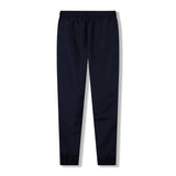 The Ireland 26 Legends 32″ Trackpant by Canterbury features a solid navy blue design with an elastic waistband and elastic cuffs, evoking the classic Canterbury track pants style, shown against a white background.