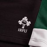 Close-up of black, green, and white Ireland Legends 7" Shorts by Canterbury, featuring the embroidered Irish Rugby Football Union (IRFU) logo with a shamrock and rugby ball design.