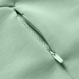 Close-up of a Canterbury Everest Zip Thru Hoodie pocket in light green by Canterbury, showing a partially open zipper and the inner lining.
