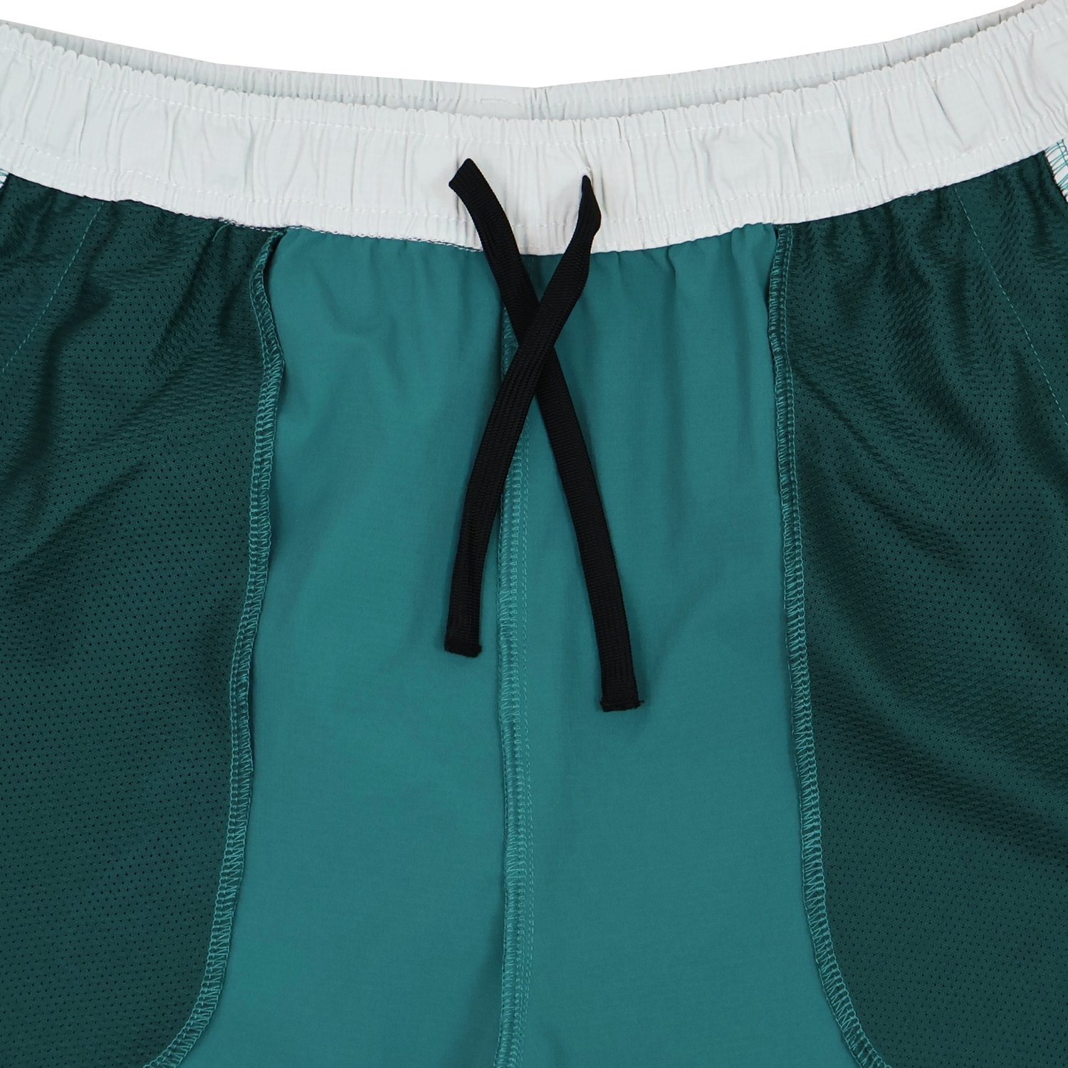 Close-up of the Canterbury Tempo+Woven 5" Short, featuring a white elastic waistband, black drawstring, and mesh side panels—ideal breathable gym shorts for men from Canterbury.