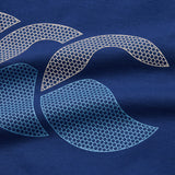 Close-up of the Canterbury Fundamentals T-shirt fabric in blue, featuring abstract honeycomb-patterned shapes in light beige and blue tones printed on the surface—a perfect detail for fans of athletic casual wear from Canterbury.