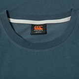 Close-up of the FUN. T-SHIRT AM in blue by Canterbury, showing the black and red brand label neatly stitched inside the neckline.