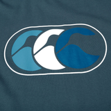 The Canterbury FUN. T-SHIRT AM features three overlapping abstract bird or wave shapes in light blue, white, and dark blue on a dark blue background—perfect for showcasing your vibrant style.