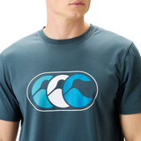 Wearing Canterbury's FUN. T-SHIRT AM—a blue crew-neck with stylized ocean waves—captures the laid-back Canterbury vibe.