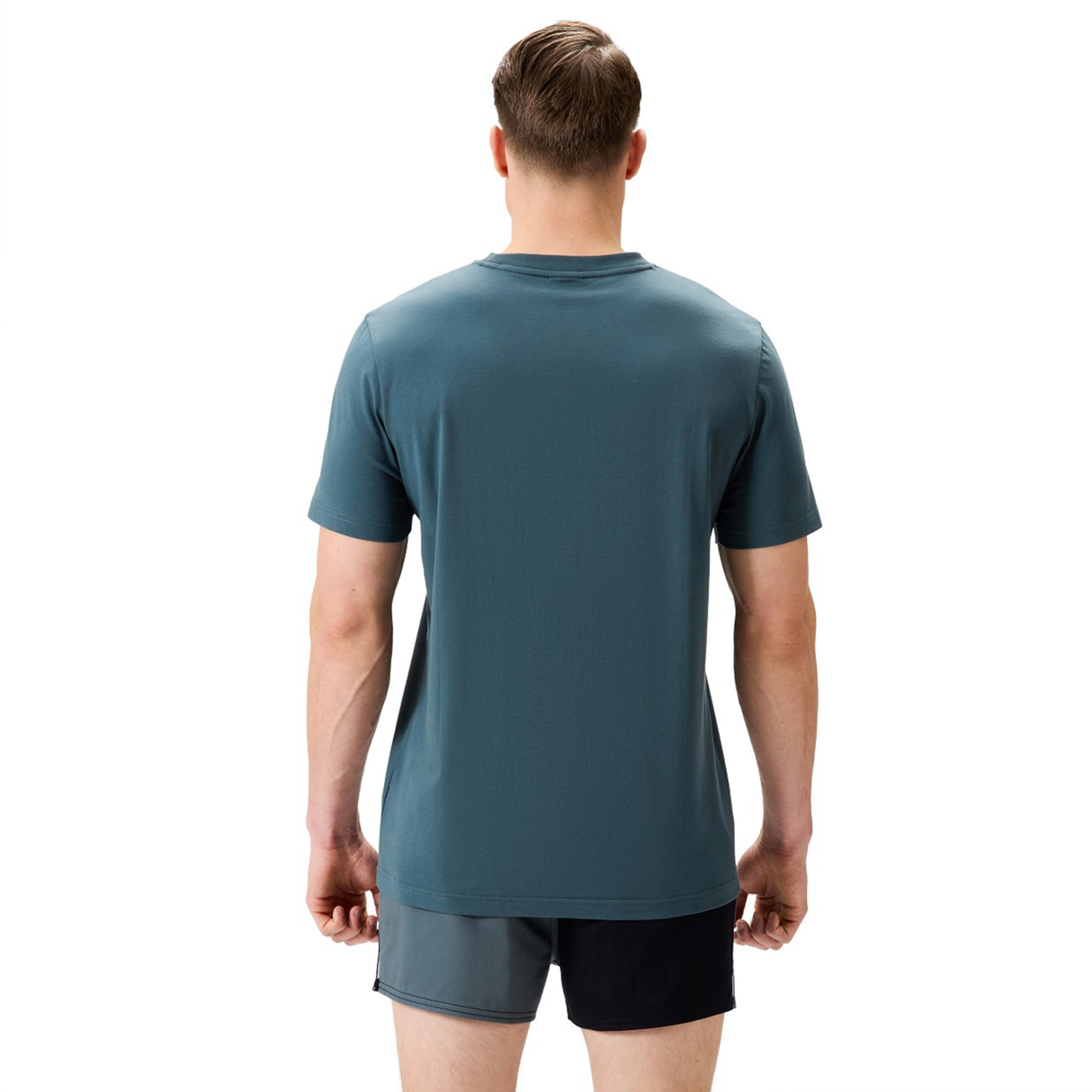 A man faces away from the camera wearing a blue FUN. T-SHIRT AM and Canterbury two-tone athletic shorts featuring one black leg and one gray leg.