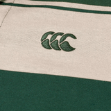 Close-up of Canterbury Yarn Stripe Polo fabric by Canterbury, featuring green and beige stripes and an embroidered logo with three overlapping green curves, showcasing classic rugby style.