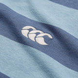 Close-up of the Canterbury Yarn Stripe Polo by Canterbury, featuring blue and navy rugby-style stripes and a white embroidered logo of three overlapping curved shapes.