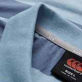 Close-up of the Canterbury Yarn Stripe Polo by Canterbury in blue stripes, highlighting the collar, label, and detailed stitching that showcase its classic rugby-inspired design.