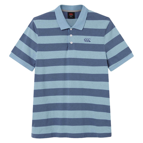 The Canterbury Yarn Stripe Polo by Canterbury is a short-sleeved rugby polo shirt featuring wide horizontal blue and light blue stripes, a traditional collar, and three white buttons on the placket, capturing the classic rugby style.