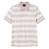 The Canterbury Yarn Stripe Polo by Canterbury features short sleeves, horizontal beige and white stripes, a classic collar with three buttons, and a subtle white logo on the upper left chest—making it an ideal choice for those seeking timeless rugby-inspired style.