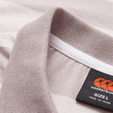 Close-up of the Canterbury Yarn Stripe Polo shirt collar in a light hue, featuring the Canterbury brand label, size L, and “Made in China” text—emphasizing its classic rugby-inspired style.