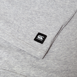 Close-up of the Canterbury Uglies Logo T-shirt, a grey cotton blend tee featuring a small black Canterbury logo patch sewn near the sleeve.
