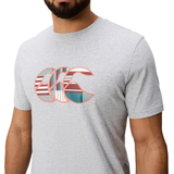 A man wears a light gray Canterbury Uglies Logo T-shirt, made from a cotton blend and featuring the iconic multicolored striped logo design on the front.