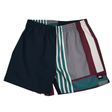 The Canterbury Uglies Harletic Short by Canterbury features an elastic waistband and a bold design with navy, teal, burgundy, gray, and white vertical and horizontal stripes.