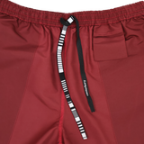 Close-up of Canterbury Uglies 5" Tactic Short in maroon, featuring an elastic waistband, small pocket, and black-and-white "Canterbury" drawstring. Durable rugby shorts designed for training performance.