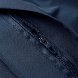 Close-up view of a dark blue zipper partially closed on matching fabric, part of the Canterbury Uglies 32" Stadium Pant.